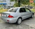 Сірий Міцубісі Lancer, об'ємом двигуна 1.58 л та пробігом 138 тис. км за 4990 $, фото 11 на Automoto.ua
