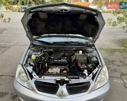 Сірий Міцубісі Lancer, об'ємом двигуна 1.58 л та пробігом 138 тис. км за 4990 $, фото 31 на Automoto.ua