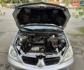 Сірий Міцубісі Lancer, об'ємом двигуна 1.58 л та пробігом 138 тис. км за 4990 $, фото 31 на Automoto.ua
