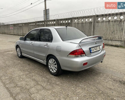 Серый Мицубиси Лансер, объемом двигателя 1.58 л и пробегом 240 тыс. км за 5500 $, фото 3 на Automoto.ua