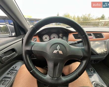 Серый Мицубиси Лансер, объемом двигателя 1.58 л и пробегом 232 тыс. км за 4900 $, фото 19 на Automoto.ua