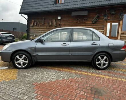 Серый Мицубиси Лансер, объемом двигателя 1.6 л и пробегом 213 тыс. км за 2400 $, фото 7 на Automoto.ua