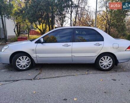 Сірий Міцубісі Lancer, об'ємом двигуна 1.58 л та пробігом 122 тис. км за 6300 $, фото 5 на Automoto.ua