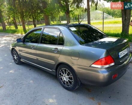 Сірий Міцубісі Lancer, об'ємом двигуна 1.58 л та пробігом 220 тис. км за 4500 $, фото 9 на Automoto.ua