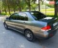 Сірий Міцубісі Lancer, об'ємом двигуна 1.58 л та пробігом 220 тис. км за 4500 $, фото 9 на Automoto.ua