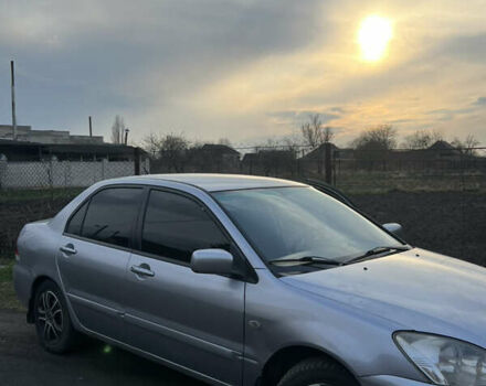 Серый Мицубиси Лансер, объемом двигателя 1.6 л и пробегом 248 тыс. км за 3000 $, фото 2 на Automoto.ua