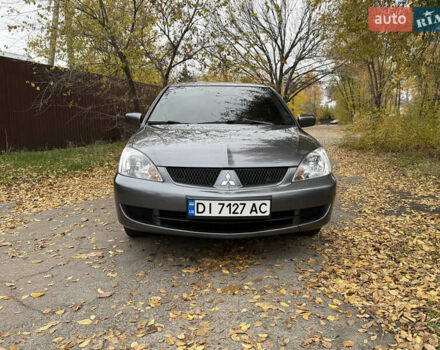 Сірий Міцубісі Lancer, об'ємом двигуна 1.58 л та пробігом 247 тис. км за 4900 $, фото 16 на Automoto.ua