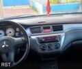 Серый Мицубиси Лансер, объемом двигателя 1.6 л и пробегом 110 тыс. км за 4250 $, фото 5 на Automoto.ua