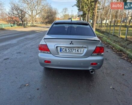 Сірий Міцубісі Lancer, об'ємом двигуна 1.58 л та пробігом 235 тис. км за 5200 $, фото 6 на Automoto.ua