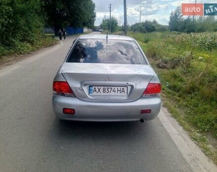 Серый Мицубиси Лансер, объемом двигателя 1.58 л и пробегом 200 тыс. км за 2300 $, фото 1 на Automoto.ua