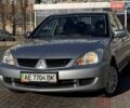 Сірий Міцубісі Lancer, об'ємом двигуна 1.6 л та пробігом 237 тис. км за 4950 $, фото 1 на Automoto.ua