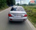 Серый Мицубиси Лансер, объемом двигателя 1.58 л и пробегом 200 тыс. км за 2300 $, фото 1 на Automoto.ua