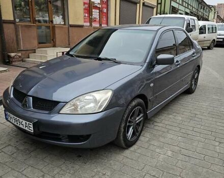 Серый Мицубиси Лансер, объемом двигателя 1.58 л и пробегом 260 тыс. км за 3700 $, фото 3 на Automoto.ua