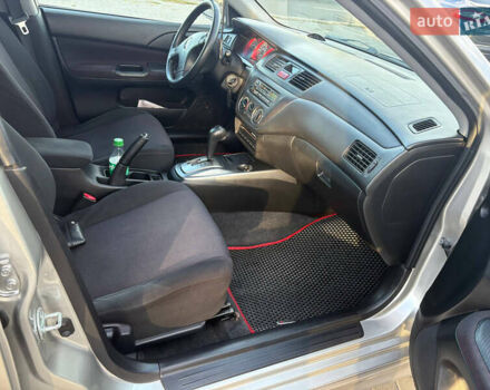 Серый Мицубиси Лансер, объемом двигателя 2 л и пробегом 184 тыс. км за 4900 $, фото 8 на Automoto.ua