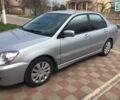 Сірий Міцубісі Lancer, об'ємом двигуна 1.6 л та пробігом 131 тис. км за 7000 $, фото 1 на Automoto.ua