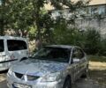 Сірий Міцубісі Lancer, об'ємом двигуна 1.6 л та пробігом 269 тис. км за 2998 $, фото 1 на Automoto.ua