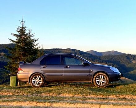 Сірий Міцубісі Lancer, об'ємом двигуна 1.6 л та пробігом 240 тис. км за 4450 $, фото 1 на Automoto.ua
