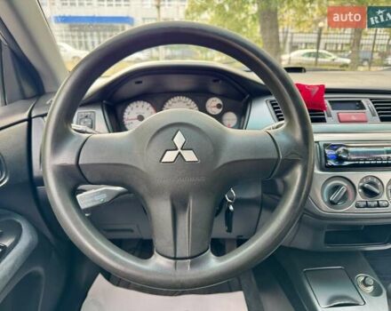 Сірий Міцубісі Lancer, об'ємом двигуна 1.58 л та пробігом 138 тис. км за 4990 $, фото 22 на Automoto.ua
