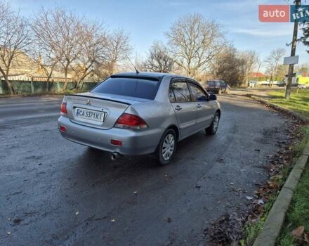 Сірий Міцубісі Lancer, об'ємом двигуна 1.58 л та пробігом 235 тис. км за 5200 $, фото 5 на Automoto.ua