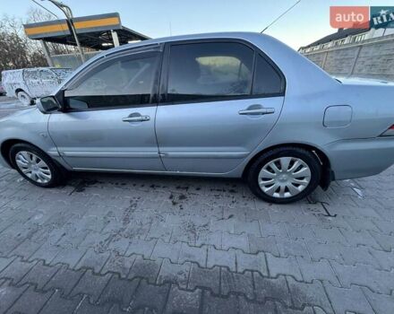 Серый Мицубиси Лансер, объемом двигателя 1.6 л и пробегом 256 тыс. км за 4500 $, фото 2 на Automoto.ua