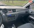Серый Мицубиси Лансер, объемом двигателя 1.6 л и пробегом 300 тыс. км за 3799 $, фото 3 на Automoto.ua