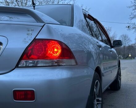 Сірий Міцубісі Lancer, об'ємом двигуна 1.6 л та пробігом 210 тис. км за 4750 $, фото 4 на Automoto.ua
