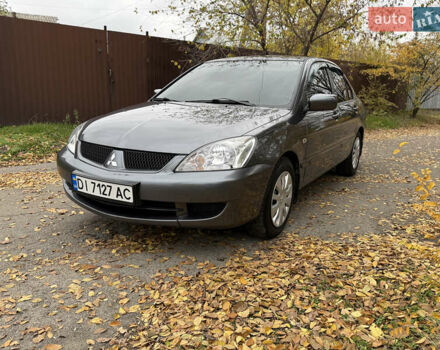 Сірий Міцубісі Lancer, об'ємом двигуна 1.58 л та пробігом 247 тис. км за 4900 $, фото 15 на Automoto.ua