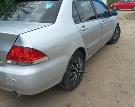 Сірий Міцубісі Lancer, об'ємом двигуна 1.58 л та пробігом 416 тис. км за 3100 $, фото 11 на Automoto.ua