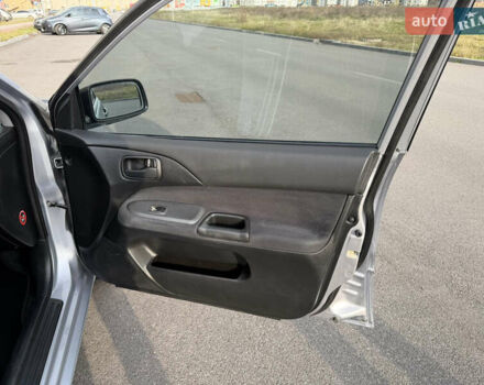 Серый Мицубиси Лансер, объемом двигателя 1.3 л и пробегом 160 тыс. км за 5555 $, фото 62 на Automoto.ua