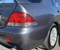 Сірий Міцубісі Lancer, об'ємом двигуна 1.6 л та пробігом 293 тис. км за 5000 $, фото 5 на Automoto.ua