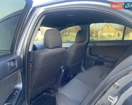 Серый Мицубиси Лансер, объемом двигателя 1.5 л и пробегом 224 тыс. км за 6300 $, фото 9 на Automoto.ua