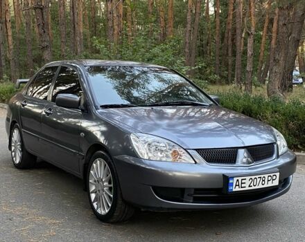 Серый Мицубиси Лансер, объемом двигателя 1.6 л и пробегом 250 тыс. км за 3999 $, фото 1 на Automoto.ua