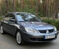 Серый Мицубиси Лансер, объемом двигателя 1.6 л и пробегом 250 тыс. км за 3999 $, фото 1 на Automoto.ua