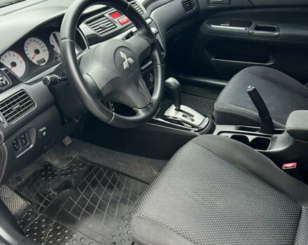 Сірий Міцубісі Lancer, об'ємом двигуна 1.58 л та пробігом 176 тис. км за 4700 $, фото 9 на Automoto.ua