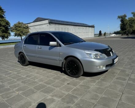 Серый Мицубиси Лансер, объемом двигателя 1.6 л и пробегом 265 тыс. км за 4100 $, фото 1 на Automoto.ua