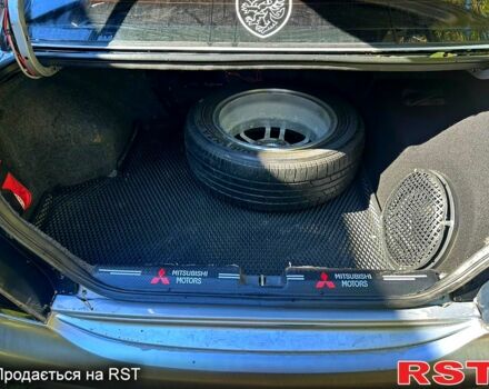 Серый Мицубиси Лансер, объемом двигателя 2 л и пробегом 300 тыс. км за 5700 $, фото 2 на Automoto.ua