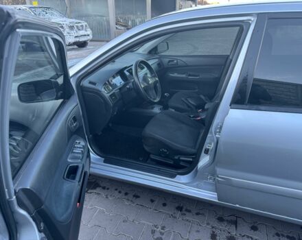 Серый Мицубиси Лансер, объемом двигателя 1.6 л и пробегом 256 тыс. км за 4500 $, фото 4 на Automoto.ua