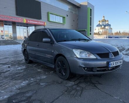 Серый Мицубиси Лансер, объемом двигателя 1.6 л и пробегом 160 тыс. км за 3700 $, фото 1 на Automoto.ua