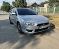 Серый Мицубиси Лансер, объемом двигателя 1.5 л и пробегом 230 тыс. км за 5850 $, фото 1 на Automoto.ua