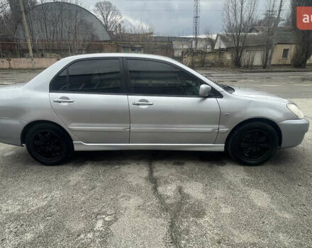 Серый Мицубиси Лансер, объемом двигателя 2 л и пробегом 230 тыс. км за 4000 $, фото 1 на Automoto.ua