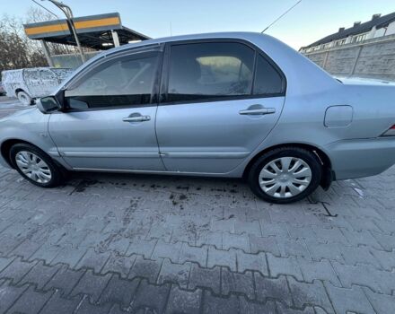 Серый Мицубиси Лансер, объемом двигателя 1.6 л и пробегом 256 тыс. км за 4500 $, фото 3 на Automoto.ua