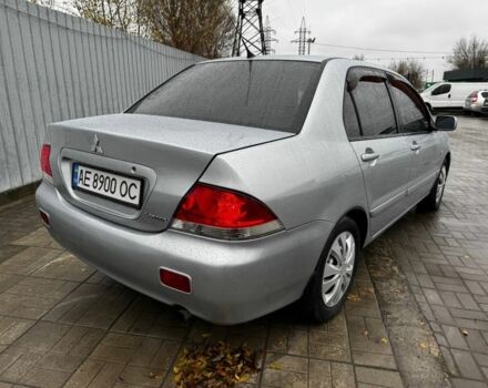Серый Мицубиси Лансер, объемом двигателя 1.6 л и пробегом 205 тыс. км за 5300 $, фото 2 на Automoto.ua
