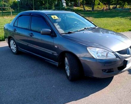 Сірий Міцубісі Lancer, об'ємом двигуна 1.6 л та пробігом 300 тис. км за 4400 $, фото 1 на Automoto.ua