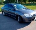 Сірий Міцубісі Lancer, об'ємом двигуна 1.6 л та пробігом 300 тис. км за 4400 $, фото 1 на Automoto.ua