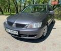 Серый Мицубиси Лансер, объемом двигателя 1.58 л и пробегом 180 тыс. км за 3499 $, фото 1 на Automoto.ua