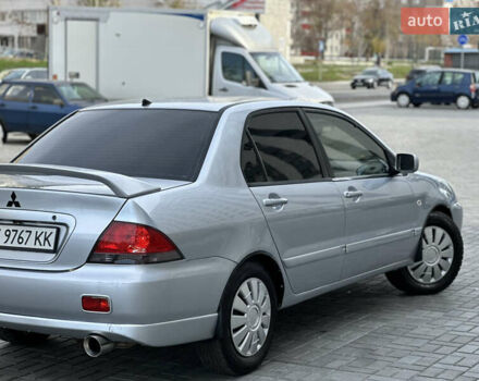 Серый Мицубиси Лансер, объемом двигателя 1.6 л и пробегом 200 тыс. км за 3900 $, фото 1 на Automoto.ua