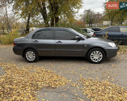 Сірий Міцубісі Lancer, об'ємом двигуна 1.58 л та пробігом 247 тис. км за 4900 $, фото 9 на Automoto.ua