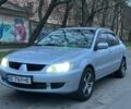 Сірий Міцубісі Lancer, об'ємом двигуна 1.6 л та пробігом 210 тис. км за 4750 $, фото 1 на Automoto.ua