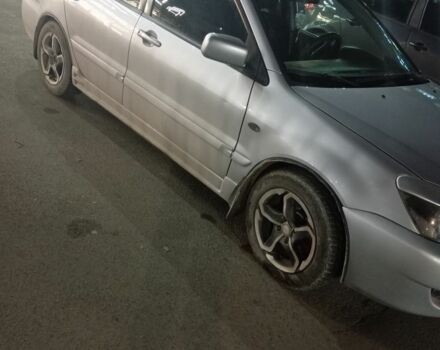 Серый Мицубиси Лансер, объемом двигателя 1.6 л и пробегом 308 тыс. км за 3800 $, фото 3 на Automoto.ua