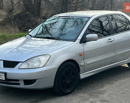 Серый Мицубиси Лансер, объемом двигателя 1.58 л и пробегом 290 тыс. км за 3750 $, фото 2 на Automoto.ua